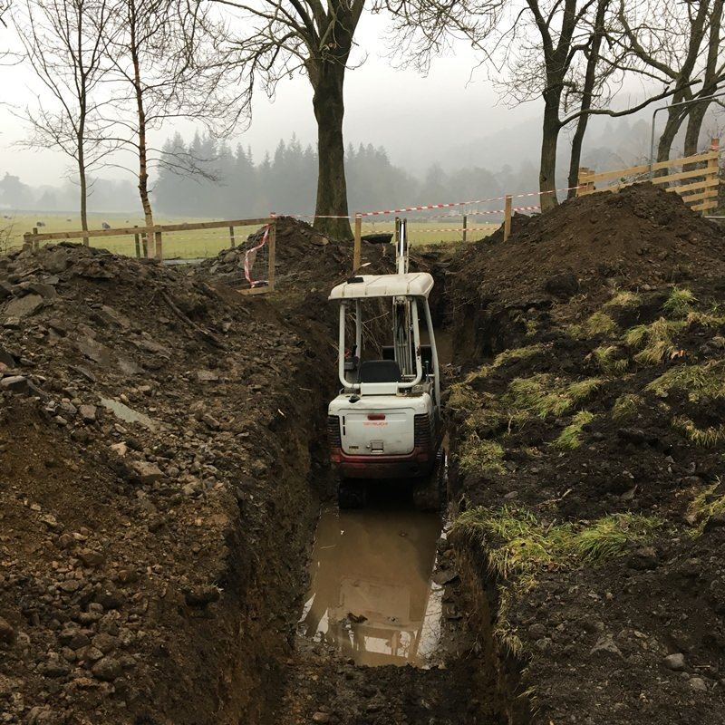 Using a Digger for Flood Defence Work in Grasmere